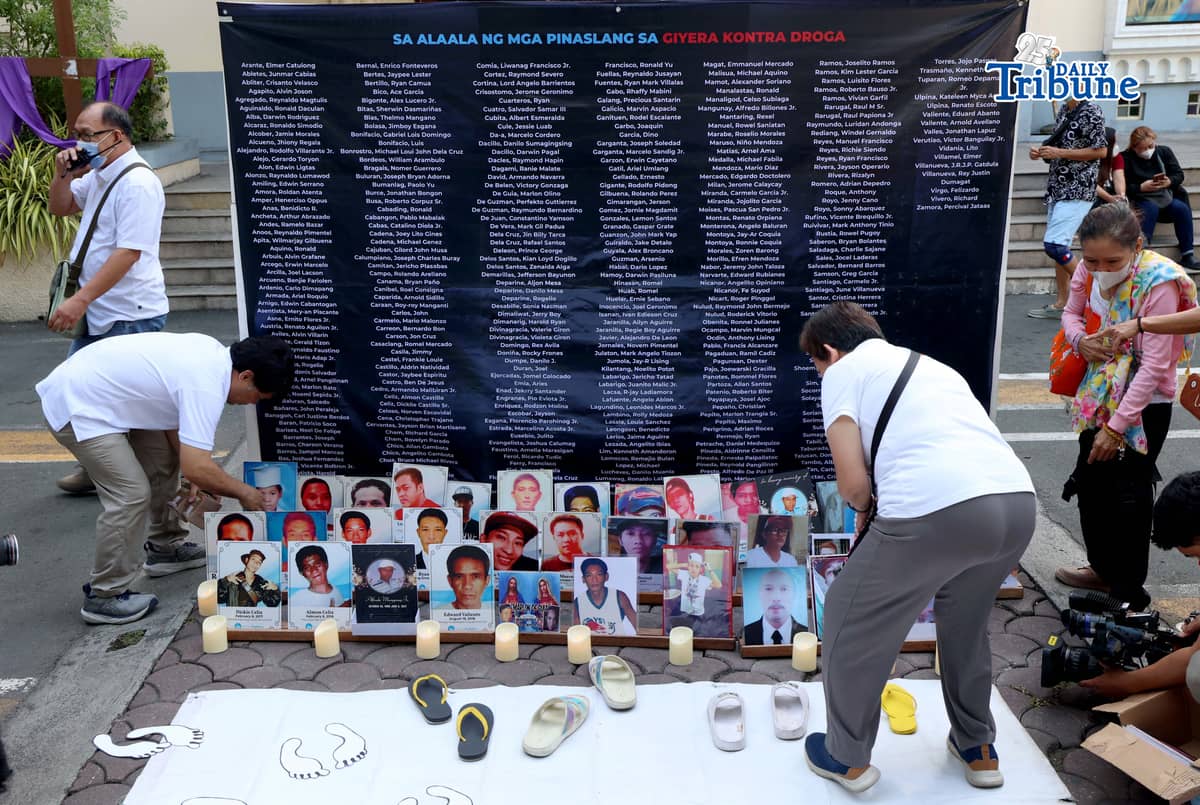 (March 11 2026) Families of EJK victims during the Duterte administration offer flowers and prayers for their departed loved ones along with photos, to mark the first anniversary of the arrest of former President Rodrigo Duterte by the International Criminal Court on Wednesday, March 11, 2026, at Sacred Heart Parish in Quezon City. Photo/Analy Labor