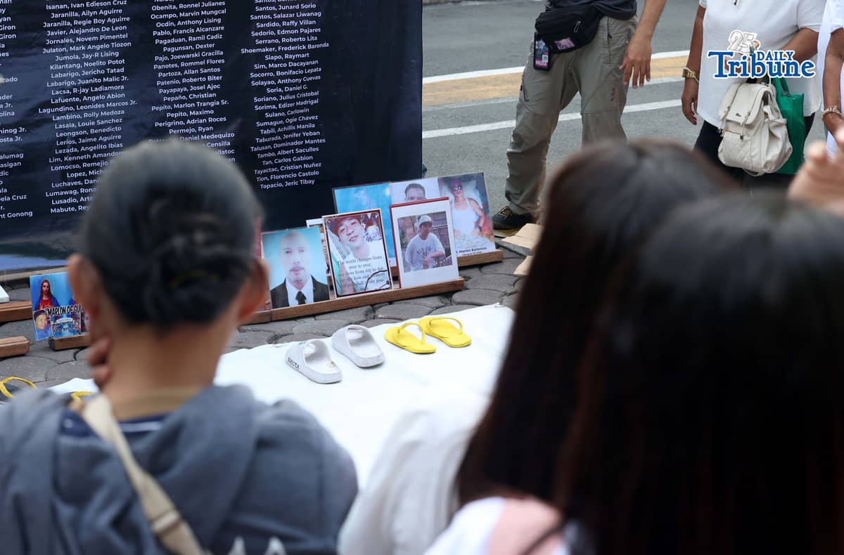 (March 11 2026) Families of EJK victims during the Duterte administration offer flowers and prayers for their departed loved ones along with photos, to mark the first anniversary of the arrest of former President Rodrigo Duterte by the International Criminal Court on Wednesday, March 11, 2026, at Sacred Heart Parish in Quezon City. Photo/Analy Labor