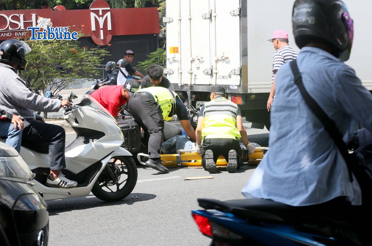 (March 11 2026) Quezon City Medics responded and rescued the accident involving a motorcycle and a closed van along Commonwealth Avenue in Quezon on Wednesday March 11 2026. Photo/Analy Labor