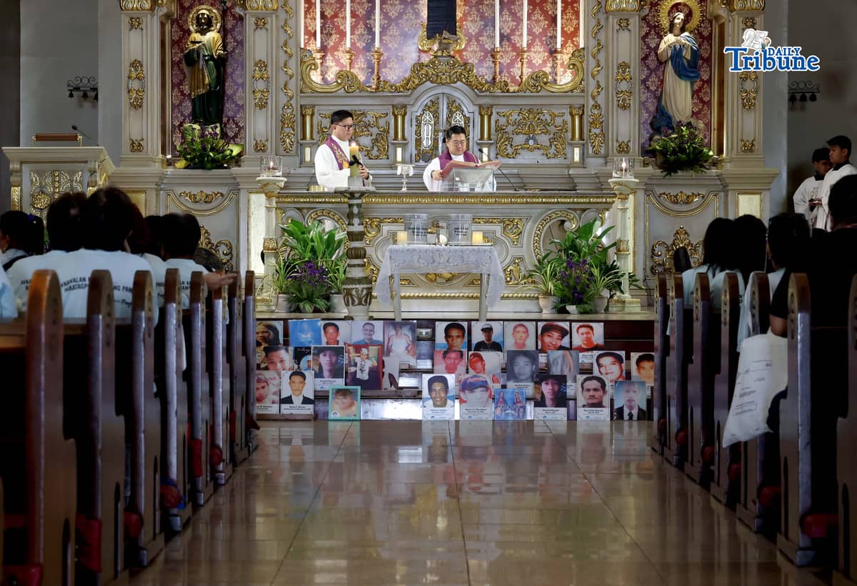 (March 11 2026) Families of EJK victims during the Duterte administration offer flowers and prayers for their departed loved ones along with photos, to mark the first anniversary of the arrest of former President Rodrigo Duterte by the International Criminal Court on Wednesday, March 11, 2026, at Sacred Heart Parish in Quezon City. Photo/Analy Labor