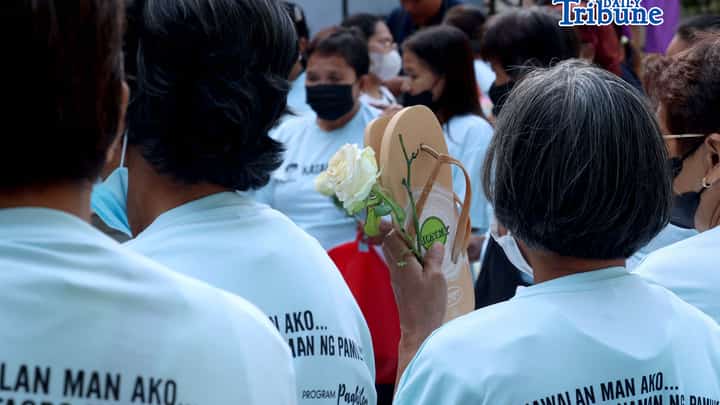 (March 11 2026) Families of EJK victims during the Duterte administration offer flowers and prayers for their departed loved ones along with photos, to mark the first anniversary of the arrest of former President Rodrigo Duterte by the International Criminal Court on Wednesday, March 11, 2026, at Sacred Heart Parish in Quezon City. Photo/Analy Labor