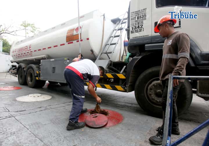 (March 11 2026) Gas attendants measure the fuel supply in their tanks at a gasoline station along East Avenue in Quezon City on Tuesday March 10 2026, following the hike in prices by oil companies due to the on-going conflict in the Middle East. Photo/Analy Labor