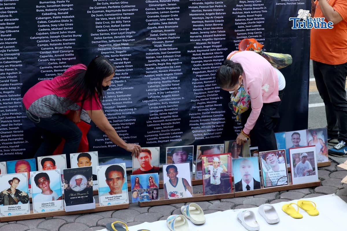(March 11 2026) Families of EJK victims during the Duterte administration offer flowers and prayers for their departed loved ones along with photos, to mark the first anniversary of the arrest of former President Rodrigo Duterte by the International Criminal Court on Wednesday, March 11, 2026, at Sacred Heart Parish in Quezon City. Photo/Analy Labor