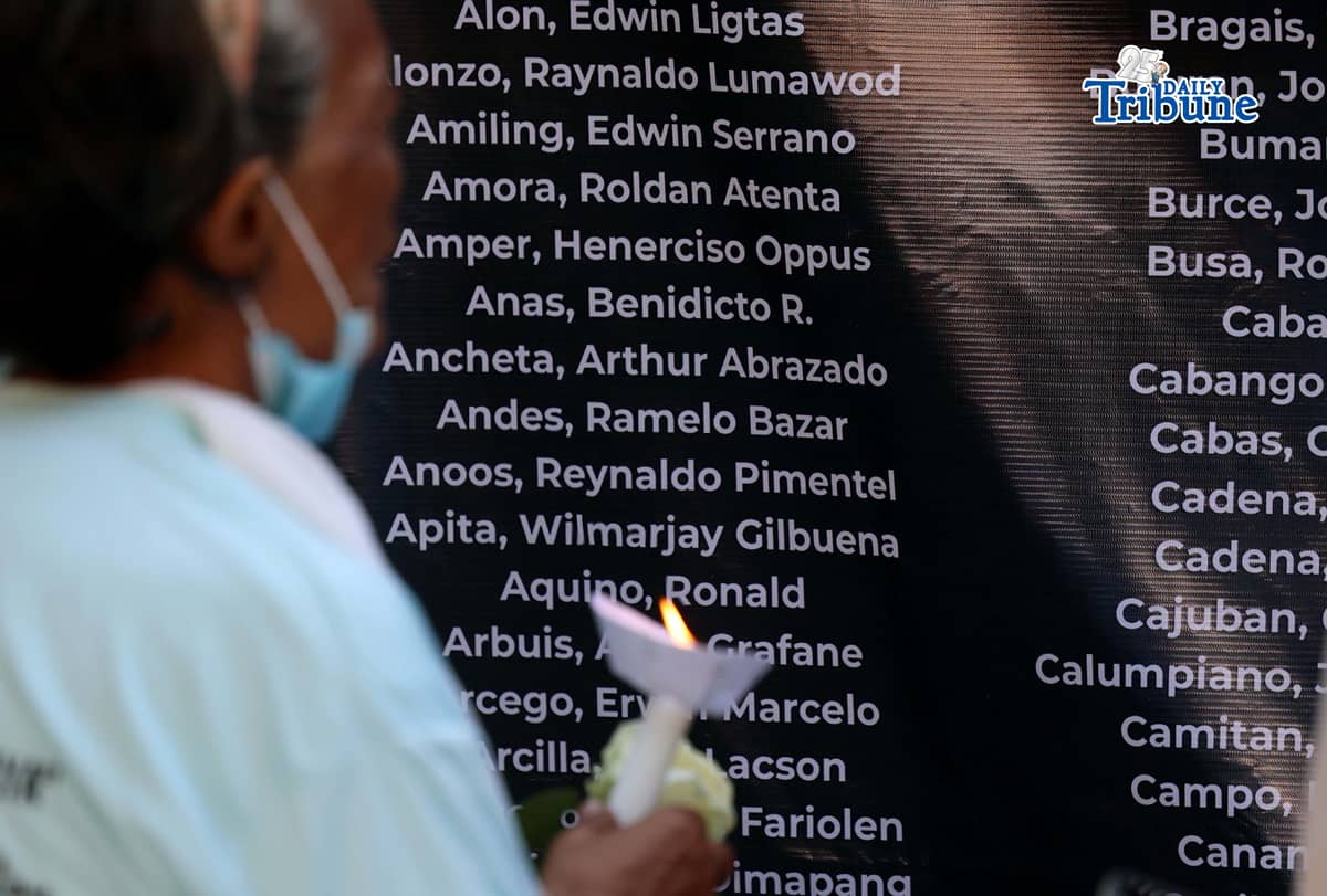 (March 11 2026) Families of EJK victims during the Duterte administration offer flowers and prayers for their departed loved ones along with photos, to mark the first anniversary of the arrest of former President Rodrigo Duterte by the International Criminal Court on Wednesday, March 11, 2026, at Sacred Heart Parish in Quezon City. Photo/Analy Labor