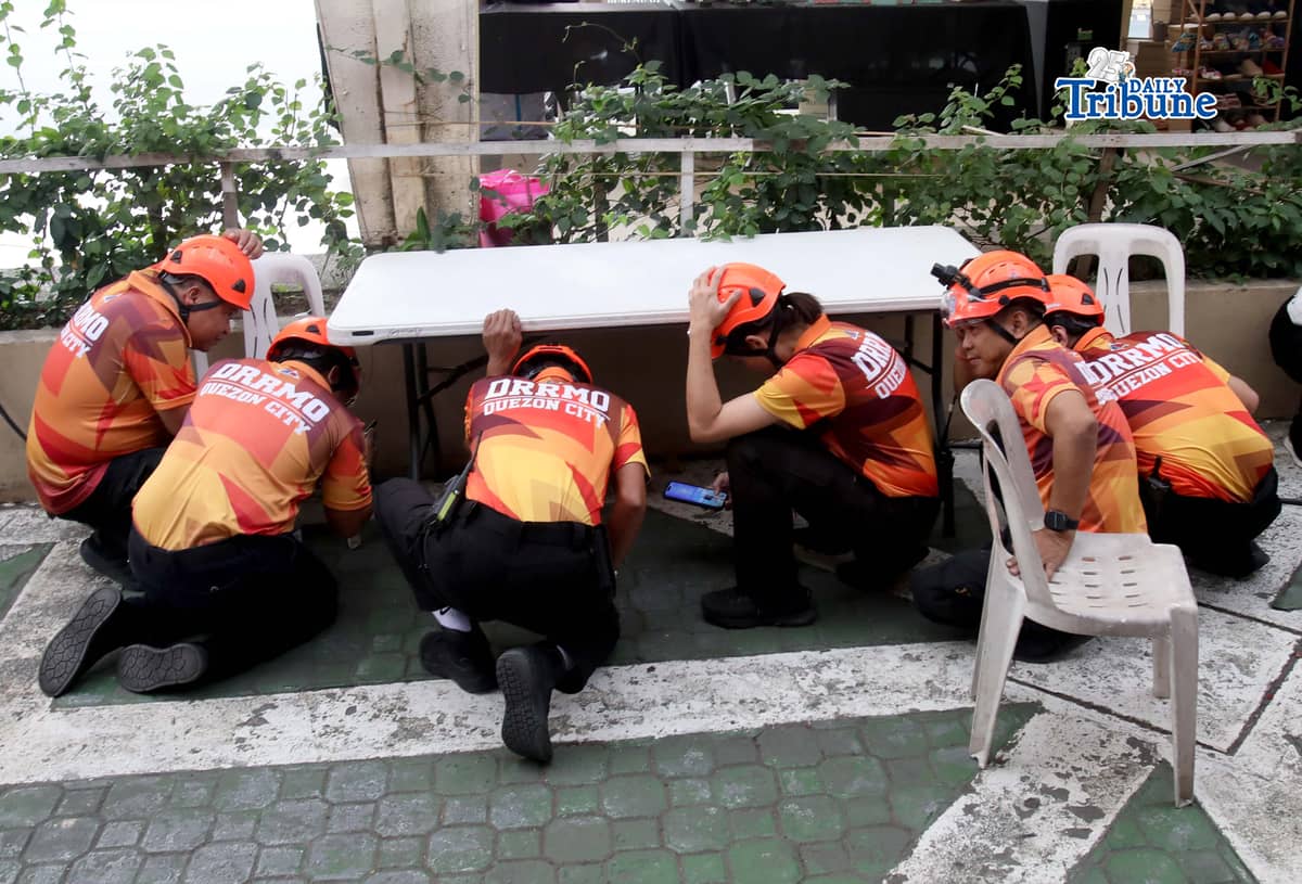 (March 12 2026) Quezon City Hall employees walk out the building as they participate in the First Quarter Nationwide Simultaneous Earthquake Drill, with the theme “Duck, Cover, and Hold: Gawin Dapat, Pero Hindi Sapat” on Thursday March 12 2026. Photo/Analy Labor