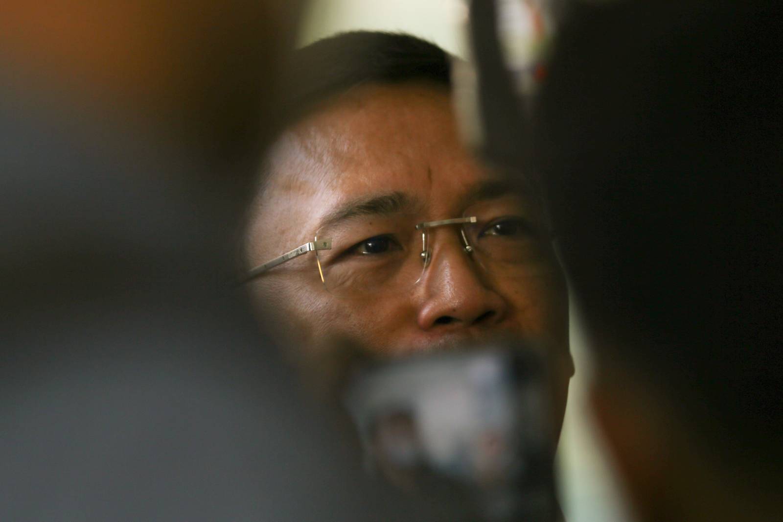 SUBPOENA SHOWDOWN. Lawyer Levito Baligod, accompanied by several alleged former Marines, arrives at the National Bureau of Investigation headquarters in Pasay City on Thursday, 12 March 2026, after being subpoenaed over allegations that they delivered suitcases of cash to Ferdinand Marcos Jr., former House Speaker Martin Romualdez and other lawmakers.