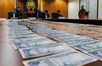 National Bureau of Investigation Director Atty. Melvin Matibag and Bangko Sentral ng Pilipinas representative Atty. Mark Fajardo inspect the alleged counterfeit foreign banknotes and U.S. Treasury bills seized in a buy-bust operation during a press conference in Pasay City on Friday, 13 March 2026.
The suspect was arrested after a three-month investigation by the NBI Criminal Intelligence Division, with authorities recovering alleged fake U.S. dollar banknotes and other foreign currencies valued at about 12 billion pesos.
“Sa Amerika, ayan po ay accepted. Dito sa atin, hindi. I don’t know why?” the suspect said.