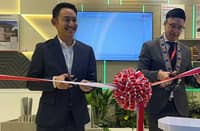 FROM left, Khun Chanon Sangkaew, manager of the Construction Value Creation Department, and Rangsant Srimangkorn, minister and deputy chief of mission of the Royal Thai Embassy, unveil the SCG Greenovation booth during WORLDBEX 2026 at the World Trade Center Manila.