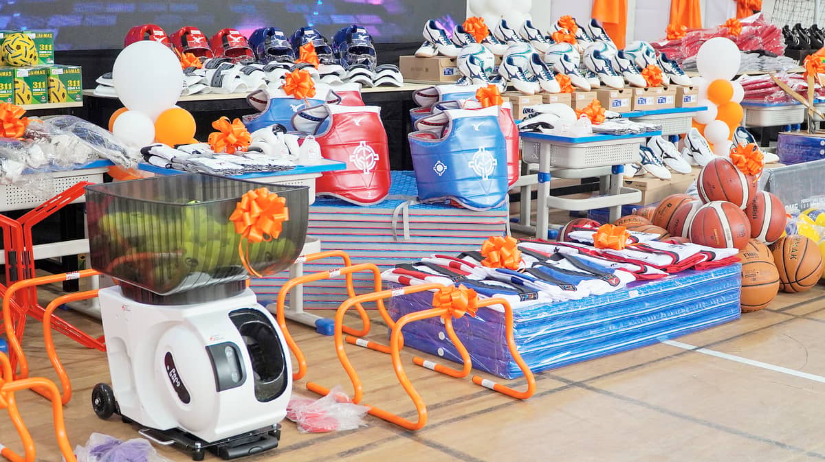 AN artificial intelligence-powered robot tennis ball launcher (left), which is among the donated sports equipment, makes RAES the only public school in Manila with such state-of-the-art tennis training machine.