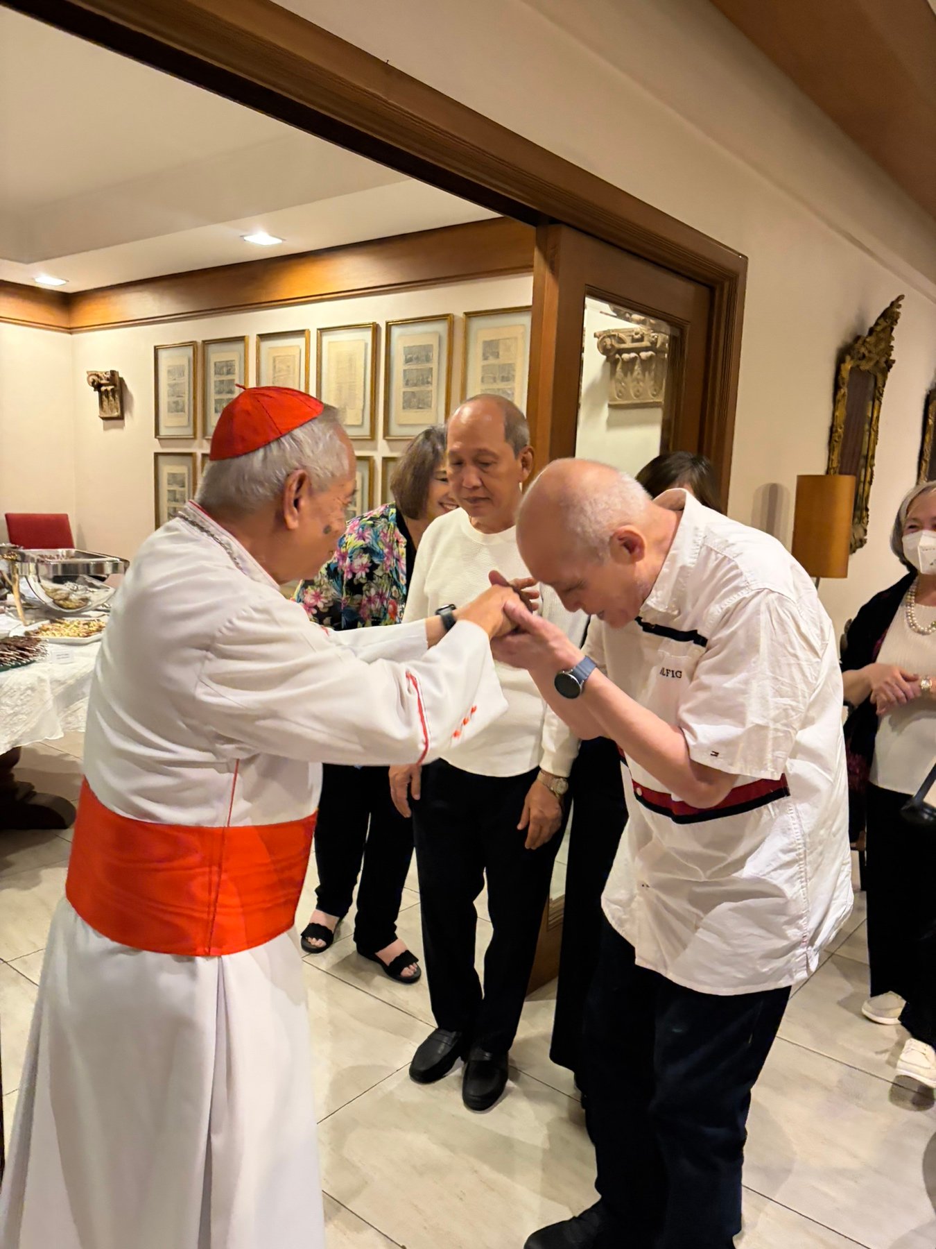 Cardinal Orlando B. Quevedo OMI (left) was greeted by his nephew, Securities and Exchange Commission Commissioner and regular Daily Tribune columnist Rogelio V. Quevedo, at his birthday dinner.