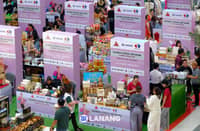 SHOPPERS browse booths from women-led MSMEs during the Women Strong Network Hybrid Trade Fair at SM Lanang, organized by WomenBizPH in celebration of Women's Month. The event features 30 exhibitors showcasing products and innovations from women entrepreneurs.