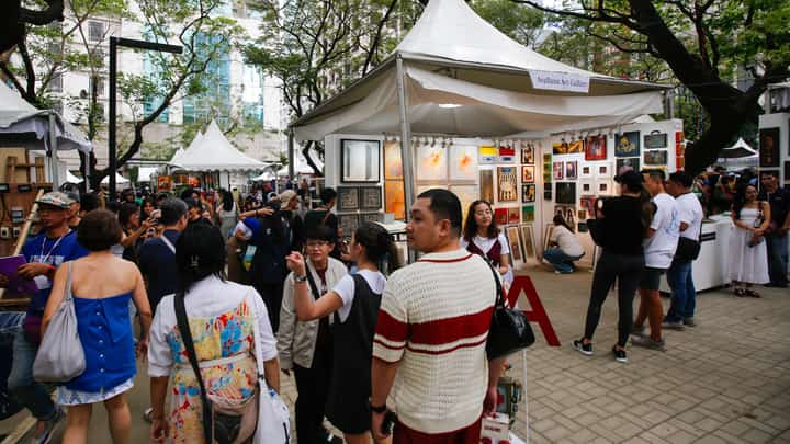Art enthusiasts, collectors, and artists converge at Jaime Velasquez Park in Makati City on 15 March 2026, for the 20th anniversary of Art in the Park. The annual one-day event features dozens of exhibitors and thousands of affordable pieces, continuing a two-decade mission to democratize the local creative scene.