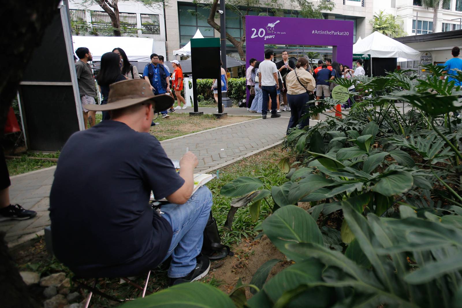Art enthusiasts, collectors, and artists converge at Jaime Velasquez Park in Makati City on 15 March 2026, for the 20th anniversary of Art in the Park. The annual one-day event features dozens of exhibitors and thousands of affordable pieces, continuing a two-decade mission to democratize the local creative scene.