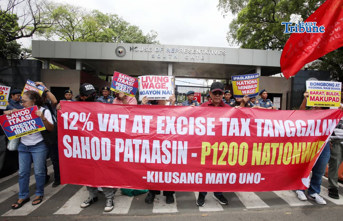 (March 16 2026) Militant group Kilusang Mayo Uno trooped to the House of Representatives in Quezon City on Monday, March 16, 2026, to protest in time with the House Committee on Labor hearing tackling legislation on the re-establishment of a National Minimum Wage to call for the abolition of Regional Wage Boards and establishment of PHP1200 nationwide minimum wage. Photo/Analy Labor