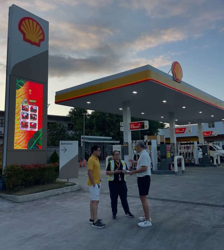 Anthony Pangilinan shares a moment at their fuel station as he outlines the price cuts he and his son are set to roll out.