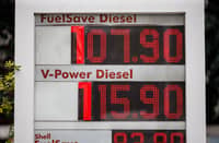 Gas stations use cardboard cutouts for their pricing displays as oil prices soar