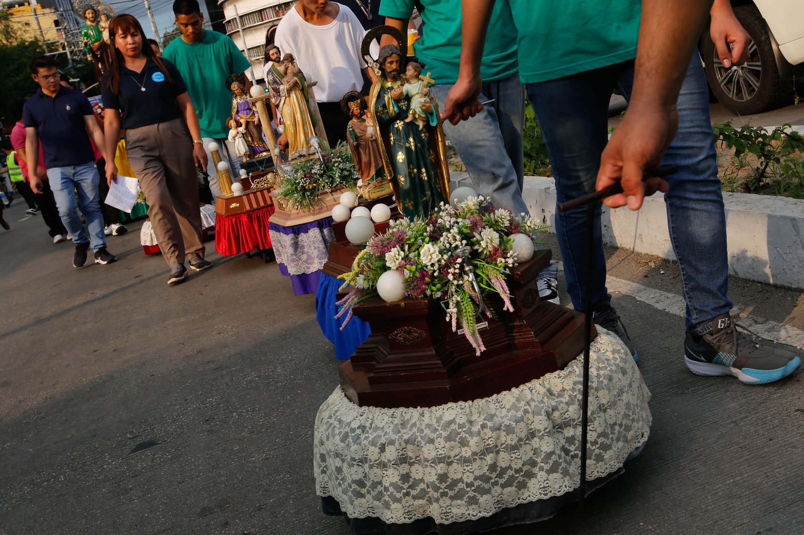 Catholic devotees carry images of St. Joseph in a procession along Ayala Boulevard in Manila this Thursday, 19 March 2026, to celebrate his feast day.