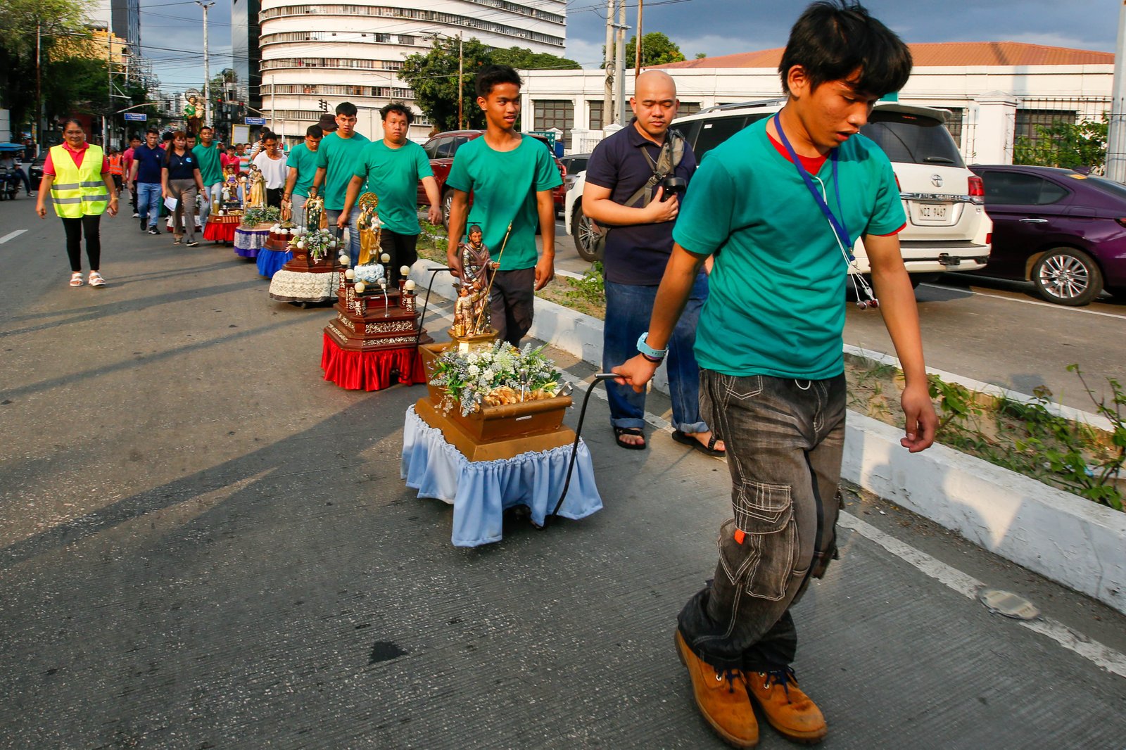 Catholic devotees carry images of St. Joseph in a procession along Ayala Boulevard in Manila this Thursday, 19 March 2026, to celebrate his feast day.