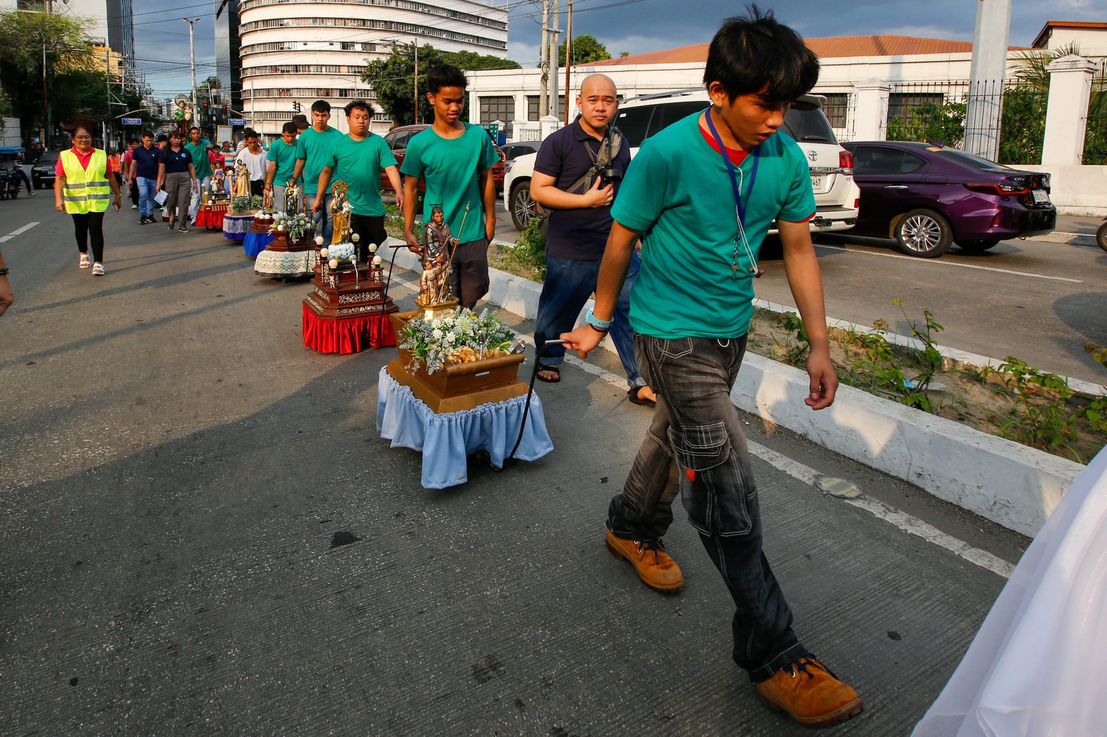 Catholic devotees carry images of St. Joseph in a procession along Ayala Boulevard in Manila this Thursday, 19 March 2026, to celebrate his feast day.