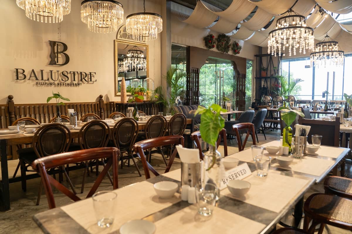 INTERIOR of Balustre Filipino Restaurant, filled with wooden posts that provide support to the railings.