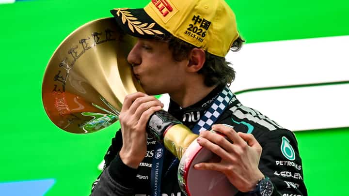 TRIUMPH sealed as Kimi Antonelli celebrates on the podium after claiming his first Formula One victory in China.