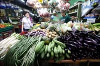(March 21 2026) Vendors arrange the vegetables they sell at stalls of the Kamuning Market in Quezon City. Vegetable prices remain high due to expensive logistics costs, fuel price surges, and previous weather damage which caused vegetable inflation to rise to 6.1%. The Department of Agriculture (DA) assures the public of stable supplies until July 2026, with some lower-priced options in wet markets. Photo/Analy Labor