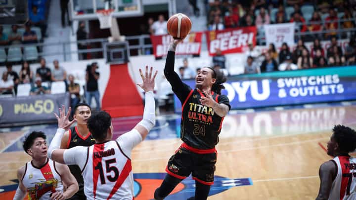 JOSHUA Munzon fires 29 points to help Titan Ultra stun San Miguel, 119-112, in the PBA Commissioner’s Cup on Saturday at the Ynares Center-Antipolo.
