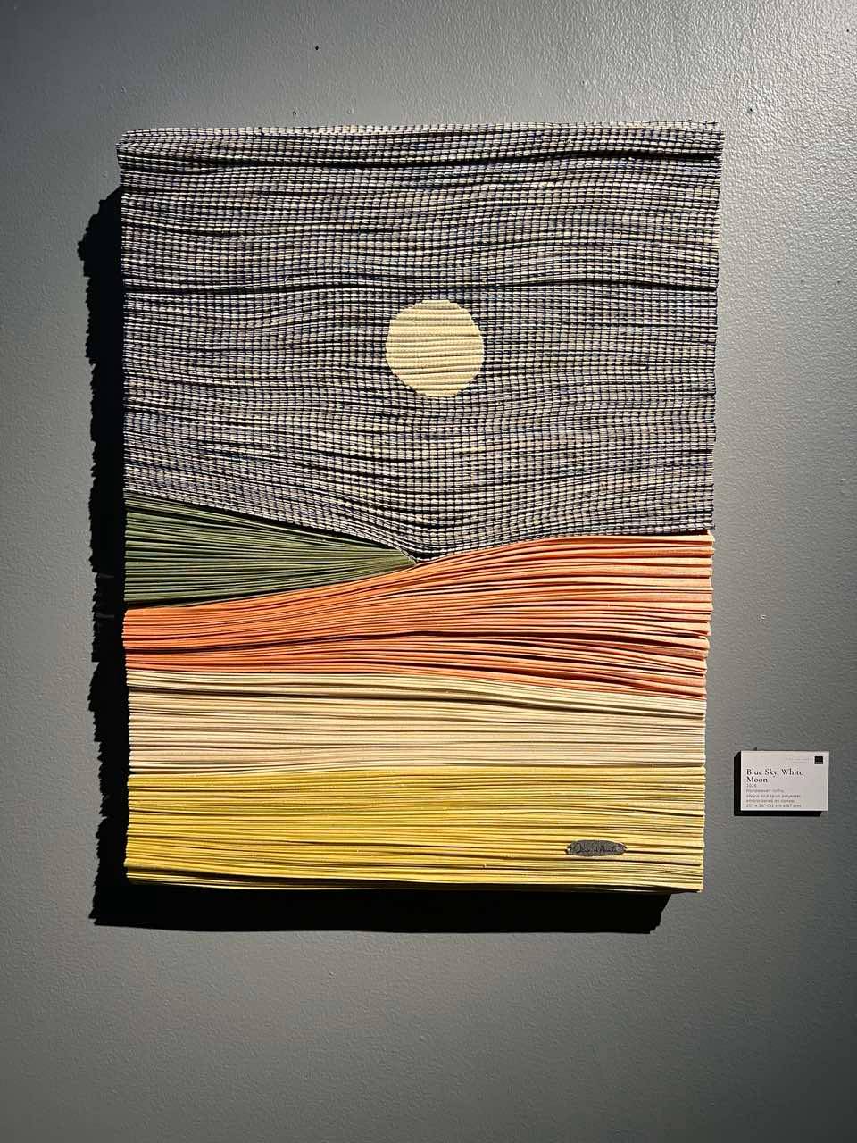 BLUE Sky, White Moon, 2026, Handwoven raffia, abaca and spun polyester embroidered on canvas, 20” x 26.”