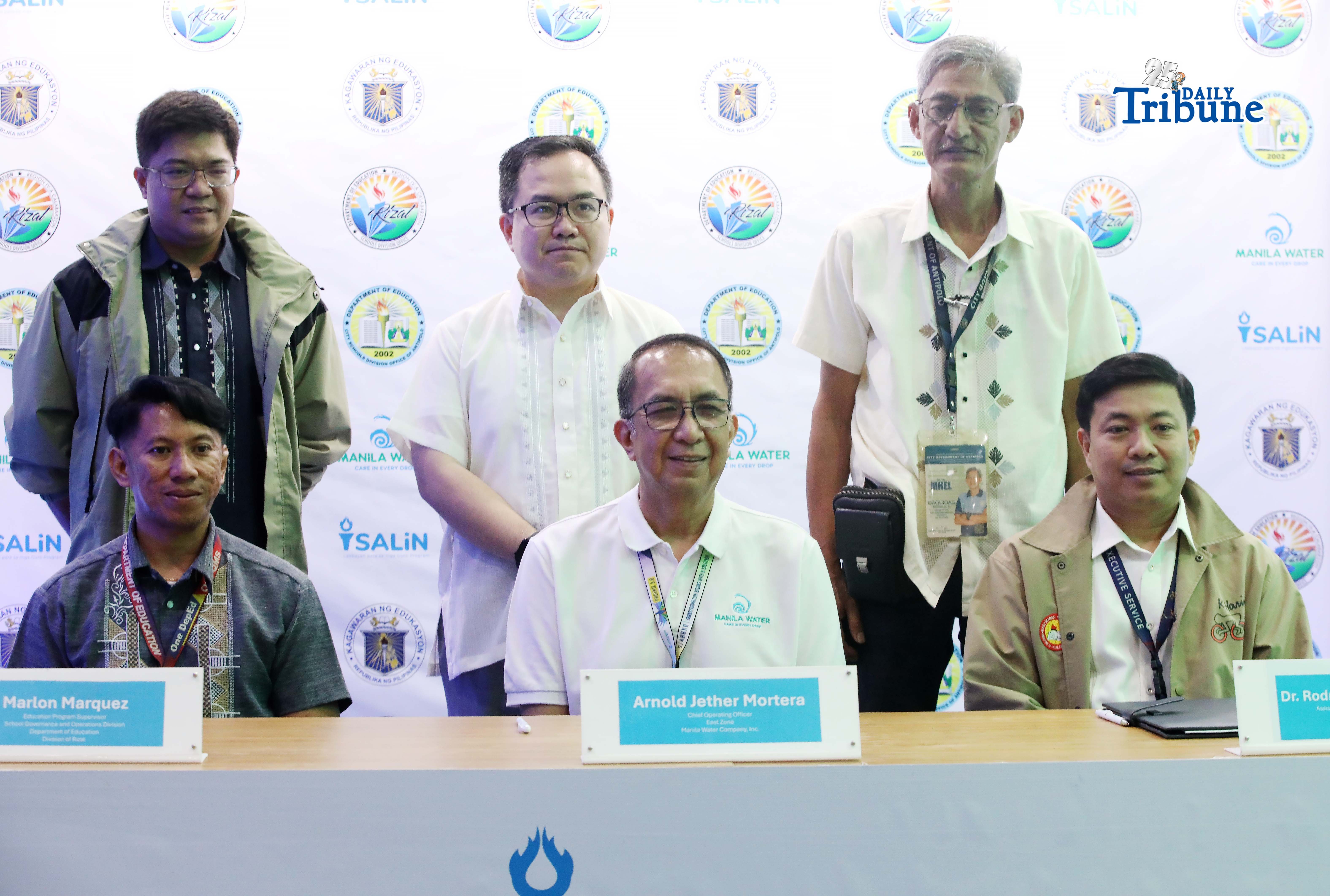Marlon Marquez, Arnold Jether Mortera and Rodrigo Rodriguez Jr. formalize a partnership between the Department of Education divisions of Antipolo and Rizal and Manila Water through the signing of an agreement expanding the Salin: Lakbayan para sa mga Guro program in celebration of World Water Day in Quezon City on Monday. The initiative engages public school teachers in promoting water stewardship through experiential learning activities at company facilities.