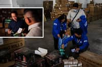 THE officials from the Bureau of Customs inspect the seized P1.4 billion worth of smuggled vape products at a warehouse in San Rafael Village, Navotas City on Monday.