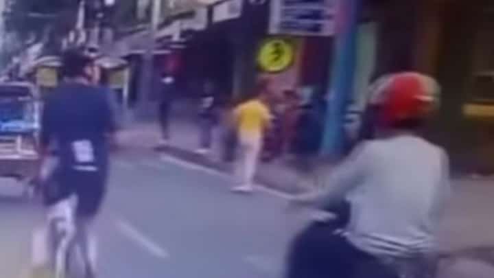 SCREEN grab from the hit-and-run incident between a motorcycle rider and an individual on a bike.
