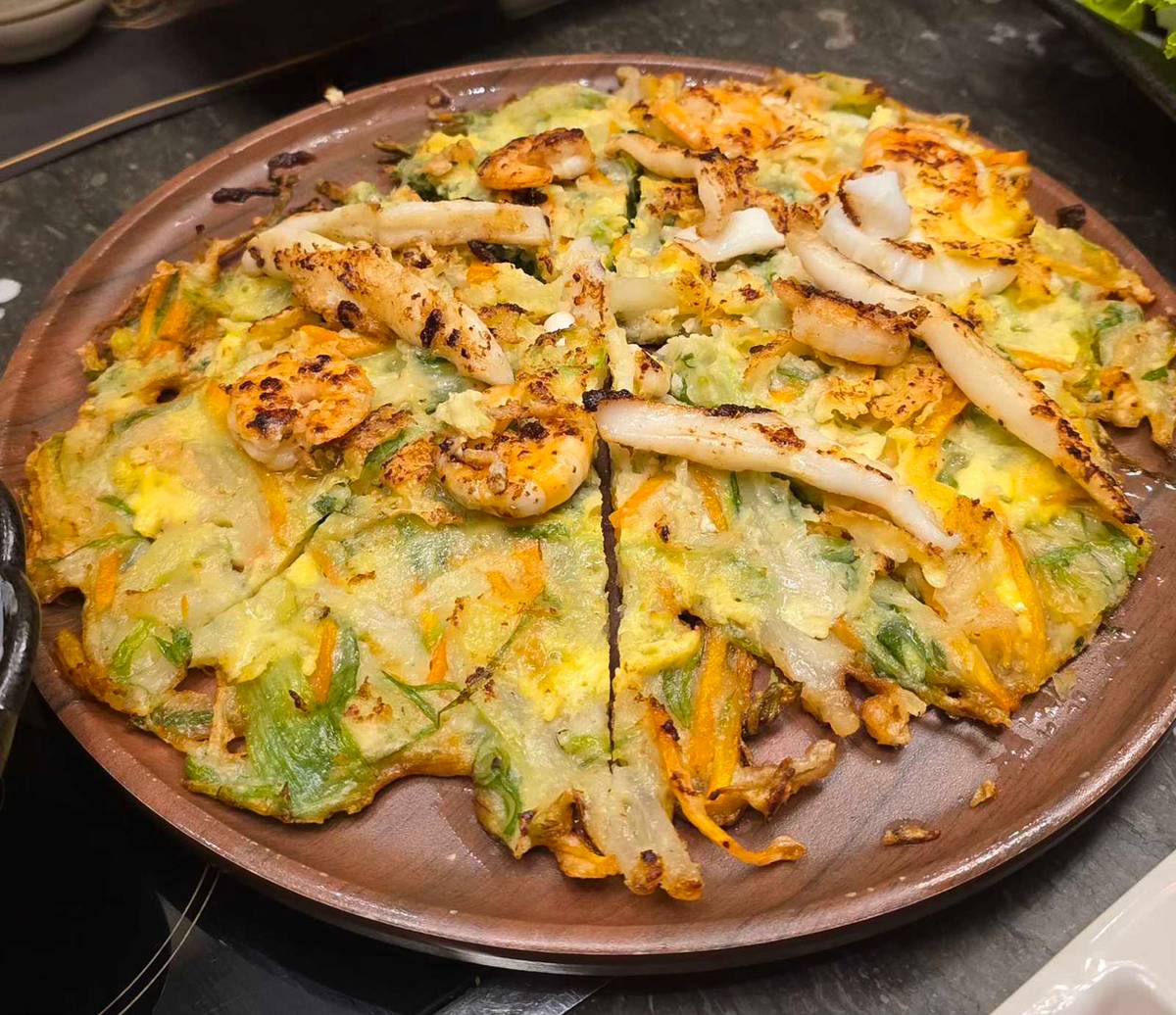 HAEMUL Pajeon — seafood pancake with vegetables.