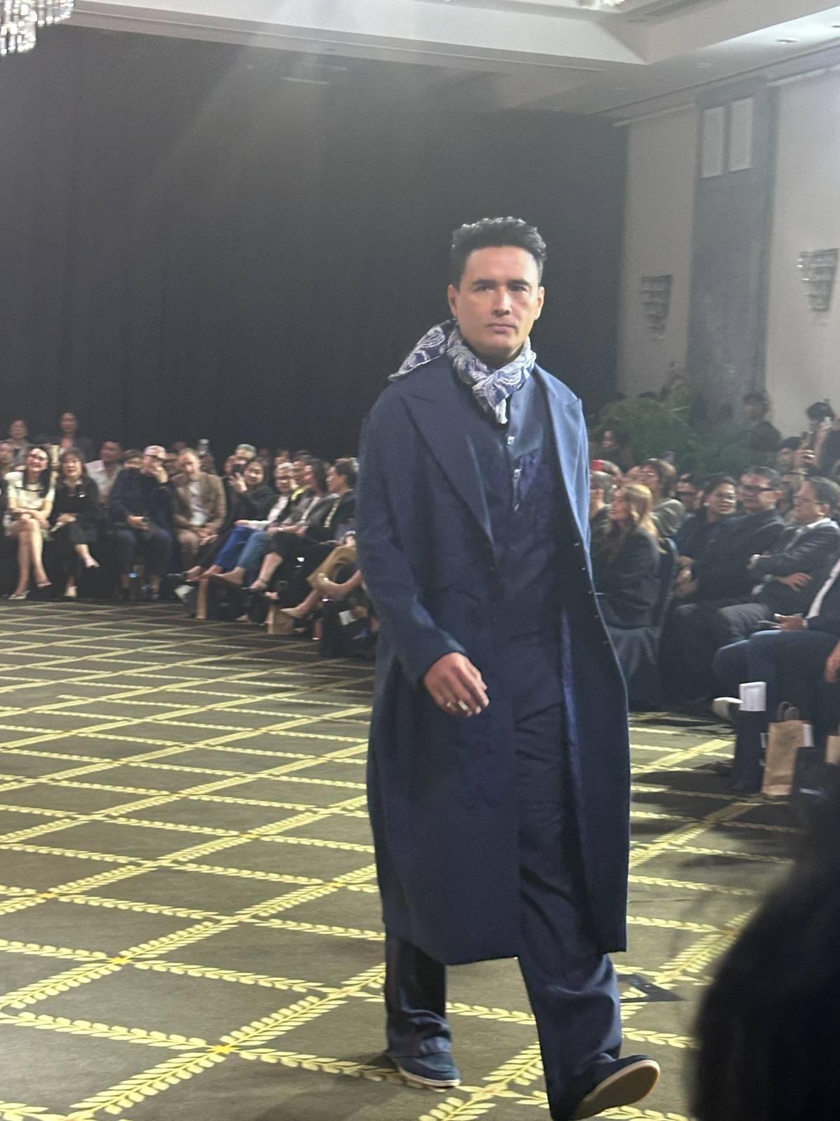ACTOR and model John Estrada in a classic blue suit and overcoat.