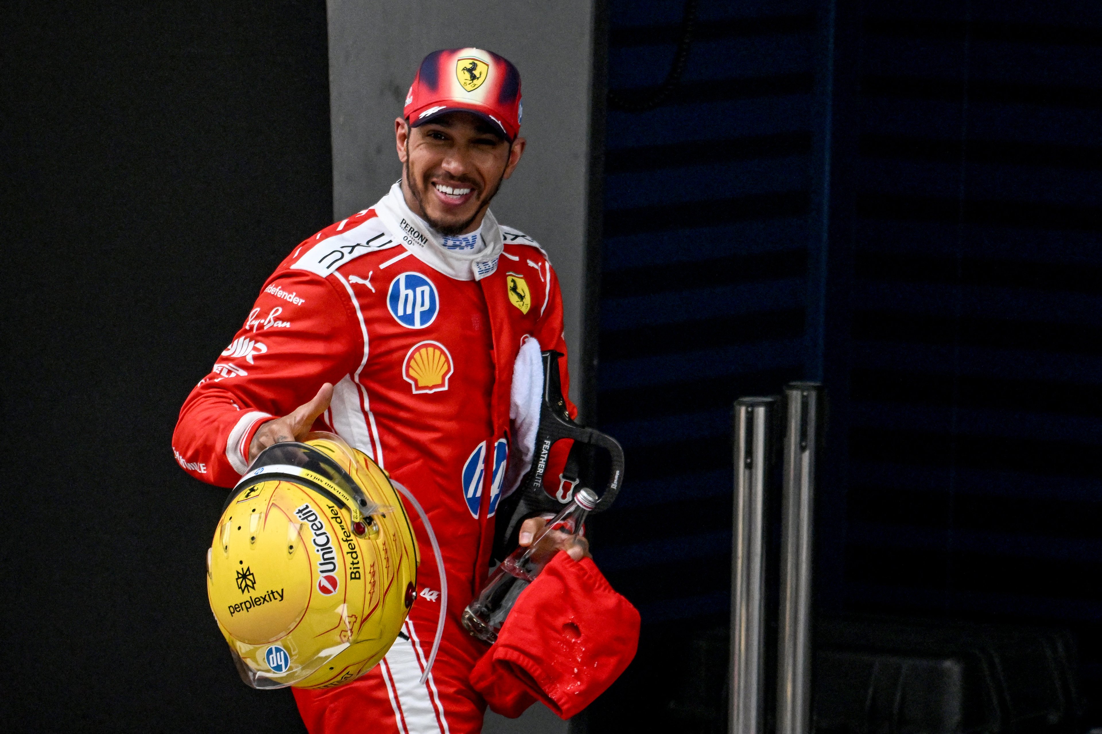 PODIUM finisher Lewis Hamilton reacts after securing his first top-three result with Ferrari in China.
