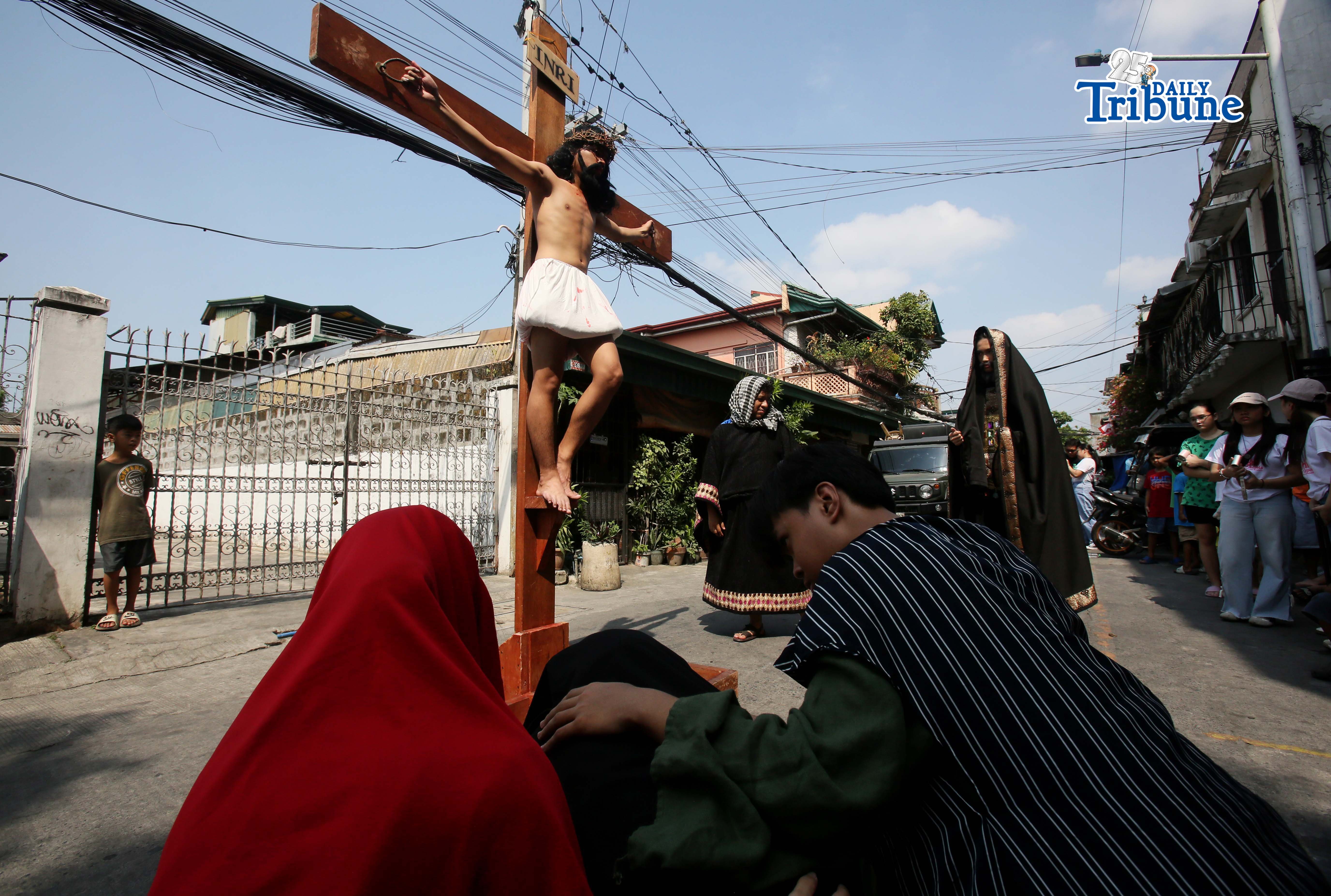 (March 28 2026) The Diocesan Shrine and Parish of Our Lady of Light, youth members take part in the Living Stations of the Cross in Barangay San Juan in Cainta on Saturday, March 28, 2026. The annual Lenten tradition, led by the parish youth ministry, brings the community together as they reenact Christ’s passion while moving through selected barangays. Cainta, Rizal, is recognized as the "Senakulo Capital of the Philippines" for its deep-rooted Holy Week tradition of performing theatrical re-enactments of the passion, death, and resurrection of Jesus Christ. Since 1904, the town has staged elaborate Passion plays involving multiple local groups. Photo/Analy Labor