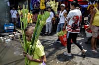 Vendors weave palm fronds into palaspas in Quiapo, Manila, on Saturday, 28 March 2026, ahead of Palm Sunday, which commemorates the successful entry of Jesus Christ into Jerusalem.
