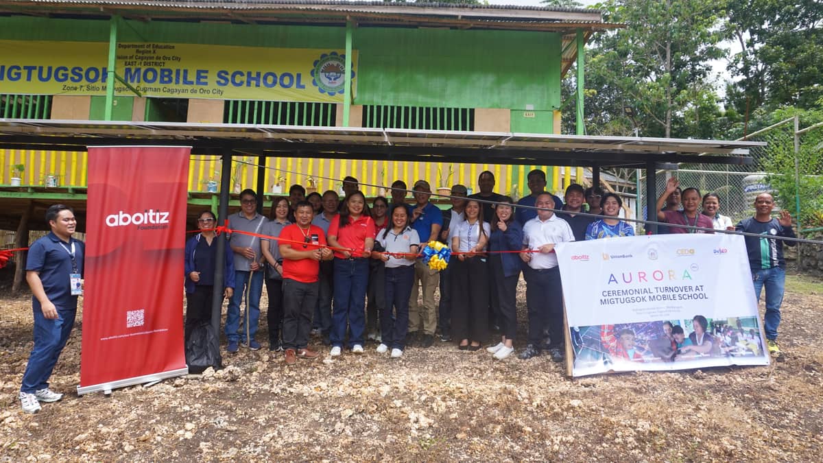ABOITIZ Group, together with local leaders, educators and community members, celebrate the installation of solar power and satellite internet at Migtugsok Mobile School, a last-mile school in Cagayan de Oro.