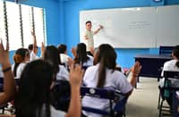 MAGTAKING Elementary School principal Christopher Macasias with students at the new school building donated by the SM Appliances Center through SM Foundation Inc.