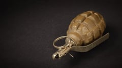 Grenade attack hurts child, damages taxi