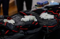 Customs officials, assisted by a K-9 unit, rip open inbound parcels containing suspected illegal drugs during a press conference at Ninoy Aquino International Airport in Pasay City on Tuesday, 31 March 2026.
The agency said the seized methamphetamine hydrochloride, or shabu, is valued at about P38 million, adding that anti-drug operations have led to the confiscation of P1.865 billion worth of illegal drugs since the start of the year.