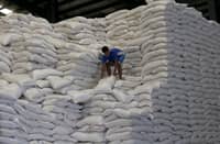 A WORKER at the National Food Authority tend to sacks of rice inside an NFA warehouse, part of ongoing efforts to secure supply for the majority of the population.