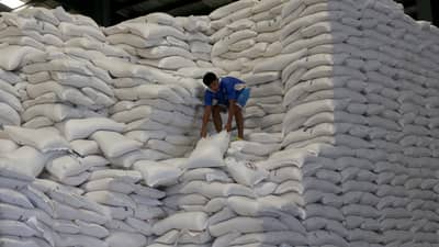 A WORKER at the National Food Authority tend to sacks of rice inside an NFA warehouse, part of ongoing efforts to secure supply for the majority of the population.