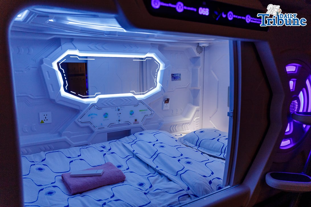 Waiting passengers stay at capsule hotel ahead of their trips for Holy Week