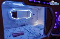 Waiting passengers stay at capsule hotel ahead of their trips for Holy Week