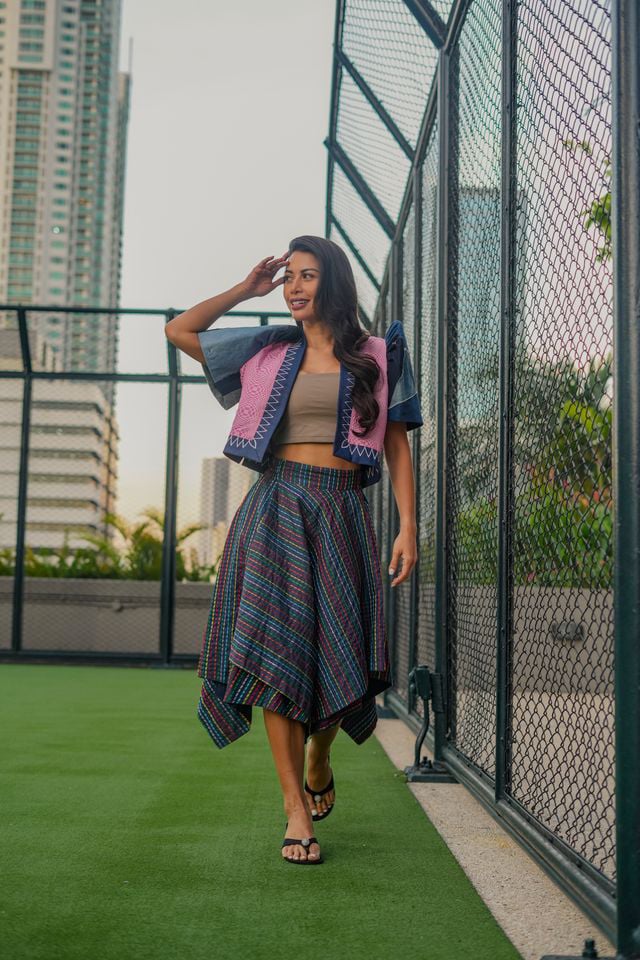 ASHLEY dons an upcycled terno bolero paired with an embroidered skirt, a look she appreciates for its strong structure and commanding silhouette.