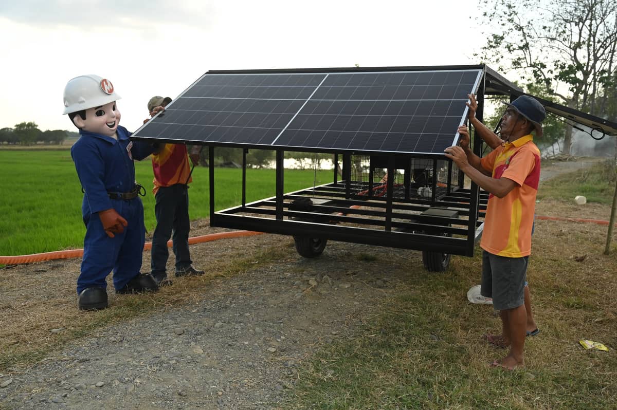 SOWING seeds of light. The members of agricultural cooperative Bagong Anyo Namcu Farmers Irrigators Association during the turnover of the solar mobile irrigation system in Cuyapo, Nueva Ecija.