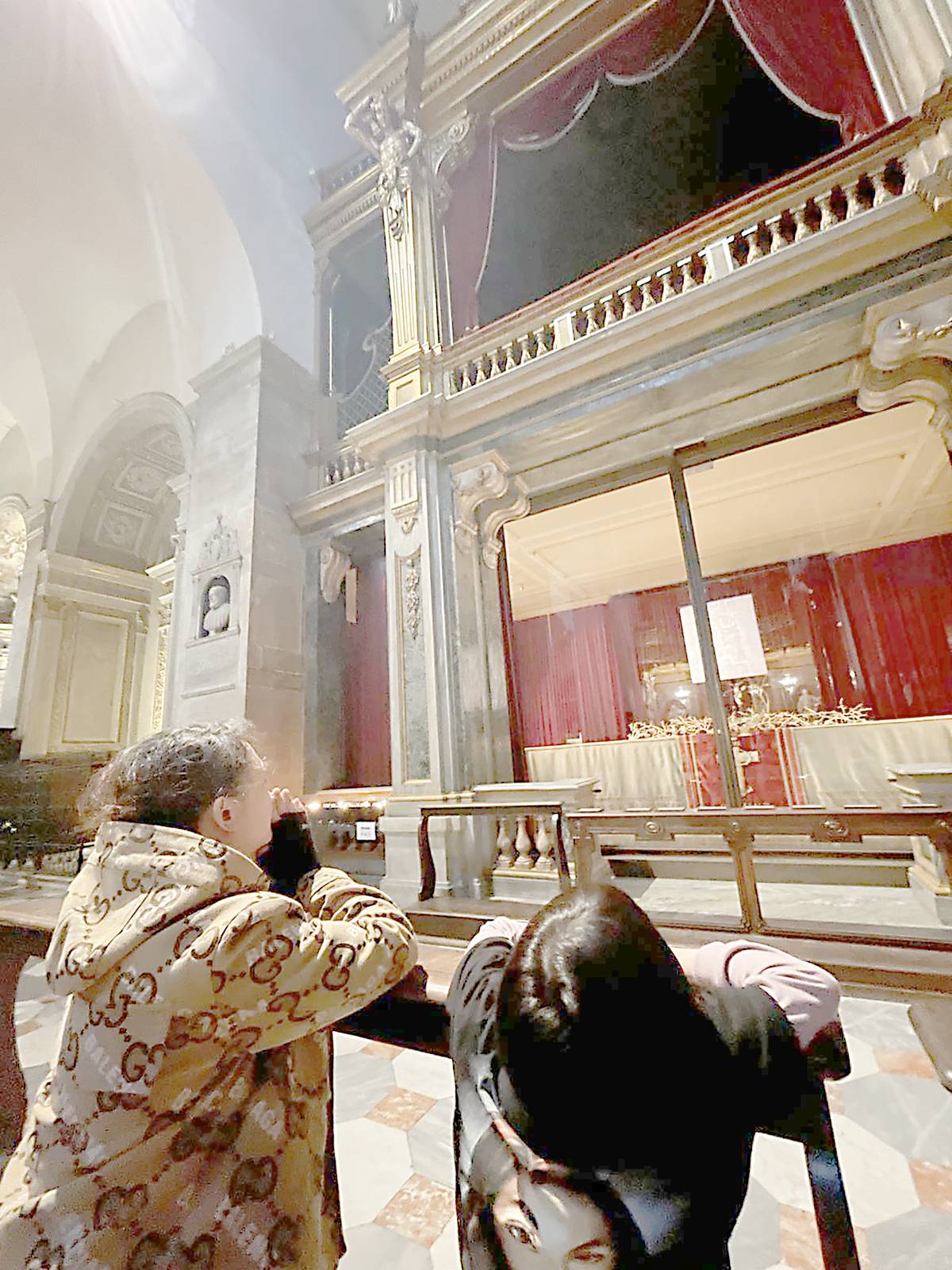 Praying in front the Shroud of Turin.