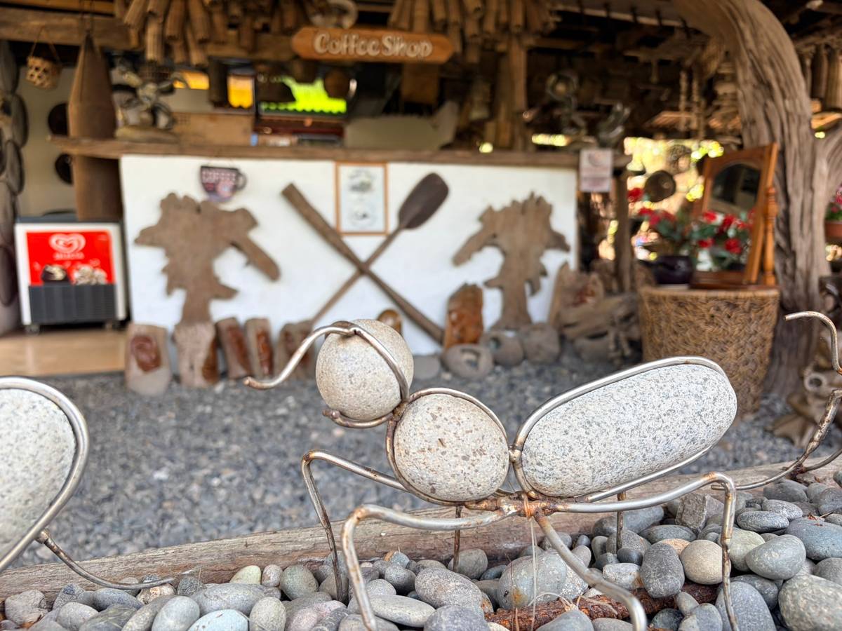 A PLAYFUL ant sculpture made of wire and beach stones adding charm in the café.