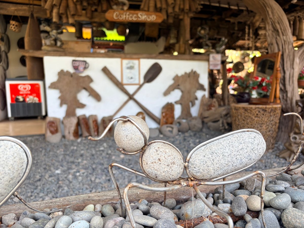 A PLAYFUL ant sculpture made of wire and beach stones adding charm in the café.