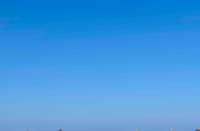 VACATIONERS enjoy a quiet Holy Week break along the shores of Zambales, where clear skies and calm waters offer a welcome escape from the city.